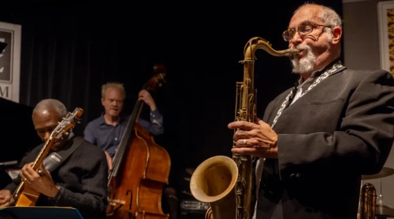 David Amram playing music.