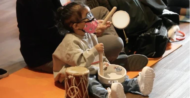 A Jitterbugs student playing the drums.