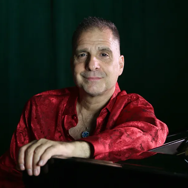 A photograph of Jazz musician John DiMartino